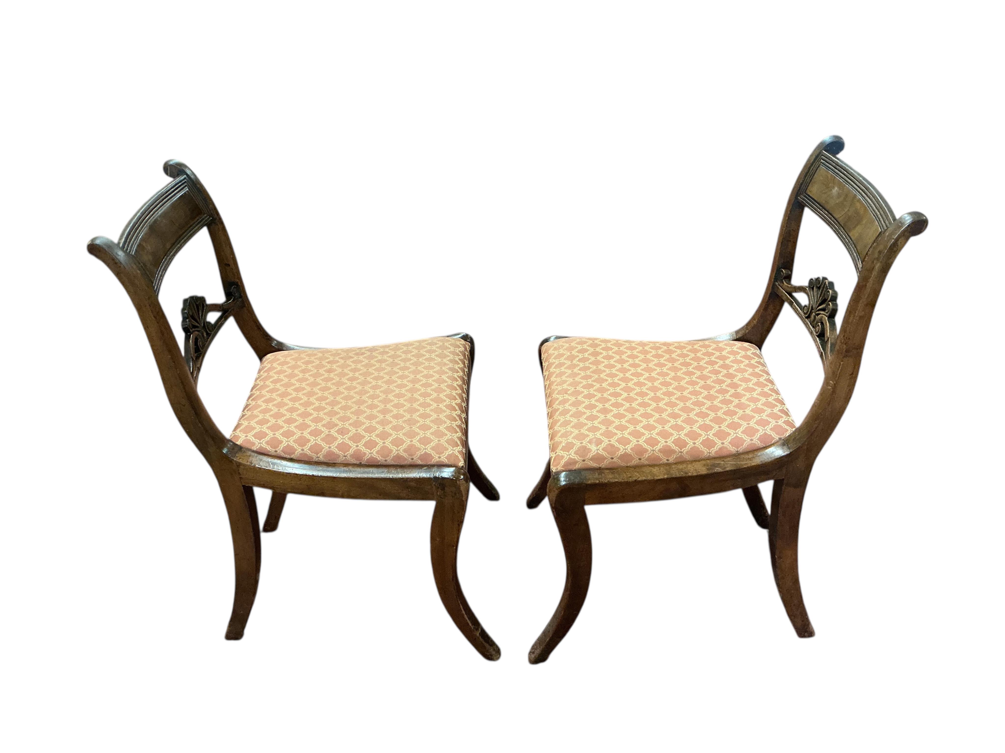 A set of eight Regency mahogany dining chairs, two with arms.